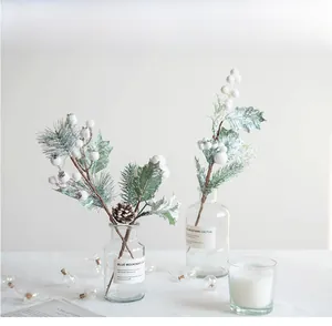 Close-up of pine needles, white berries, and pinecones for Christmas home decoration