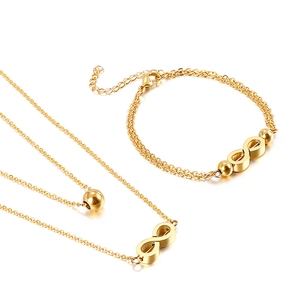 Luxurious gold double-layered necklace and bracelet set featuring infinity symbol charms