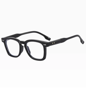 Detail of black oversized square sunglasses with silver star rivets on the temple arm