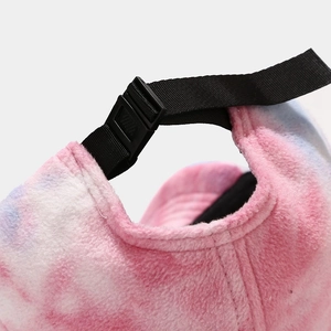 Tie-dye plush baseball cap in pink and blue with an adjustable plastic buckle closure