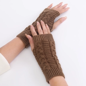 Detail of brown cable knit fingerless gloves showing high-quality texture and finger holes