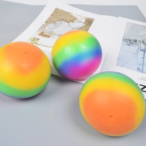 Three large rainbow colored flour stress balls for anxiety relief and sensory play