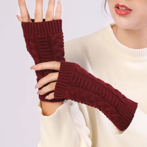 Close-up of wine red cable knit fingerless gloves for autumn and winter warmth