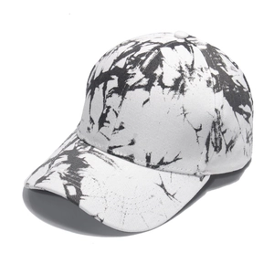 Detailed close-up of the black and white tie-dye pattern on this stylish ponytail baseball cap