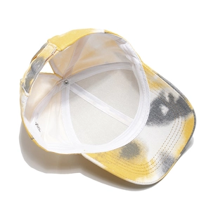 Internal view of tie-dye ponytail baseball cap with neat stitching and adjustable strap