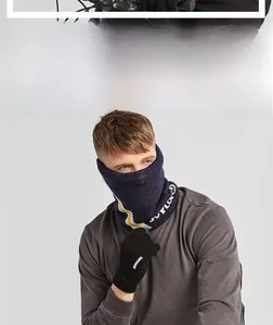 Navy knit neck warmer with striped trim and black thermal touchscreen gloves for winter