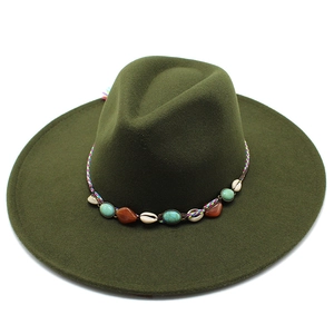 Detail of army green wool felt fedora with tribal shells and turquoise bead band