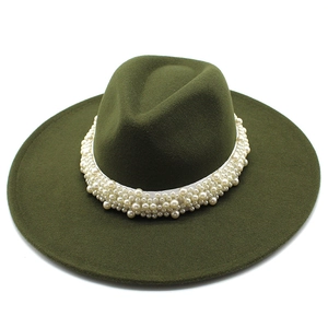 Detailed view of dark green wool felt fedora featuring premium pearl decorative band