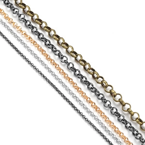 Detail showing various sizes and colors of metal jewelry chains on white background