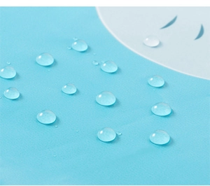Detail of waterproof light blue fabric showing water droplets on the surface