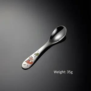 Detail of 304 stainless steel kids spoon with cute fox and tree cartoon patterns