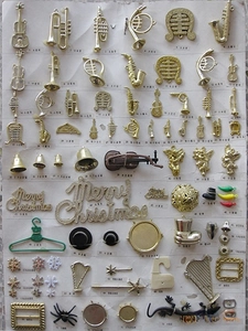 Collection of gold and silver plated Christmas ornaments, mini musical instruments and stars