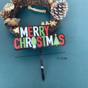 Detail of 11.5cm width black acrylic Merry Christmas cake topper with tree and bulb elements