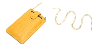 Detail of yellow woven texture mobile phone bag with golden metal chain strap