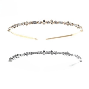 Macro shot of silver and gold rhinestone headbands with marquise and round crystal accents