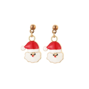 Close-up of Santa Claus enamel earrings made of red and white alloy for Christmas