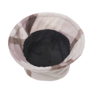 Detail of plush plaid bucket hat showing soft faux fur texture and internal adjustable strap