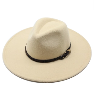 Beige wide brim wool fedora hat with leopard print band and gold buckle on white background