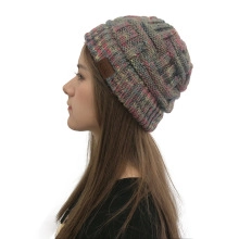 Close-up of leopard pattern knit beanie featuring a brown C.C leather patch and thick texture