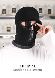 Detail of black winter knit hat with zipper opening and thick fleece lining for warmth