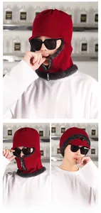 Detail of red winter knit hood with warm fleece lining and a front zipper design