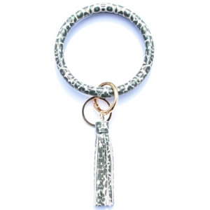 Close-up of leopard print leather keychain wristlet with golden ring and tassel