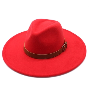 Detail of red wool felt fedora with 9.5cm wide brim and brown leather buckle band