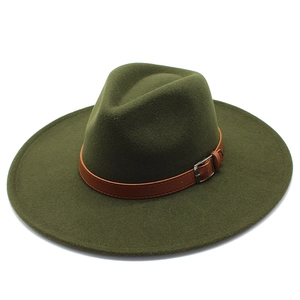 Detail of dark green wide brim fedora with brown leather band and silver buckle