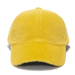 Detailed view of yellow faux fur texture on a warm winter baseball cap for women