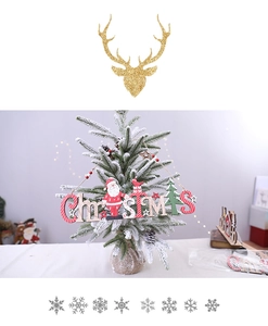 Close-up of a rustic wooden Christmas ornament featuring a reindeer and pine tree design