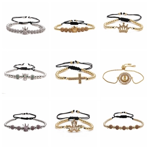 Detailed grid of adjustable beaded bracelets with zircon crowns and religious charms