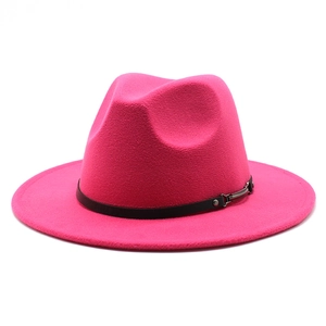 Detail of rose red wool felt fedora featuring a black ribbon band and silver metal buckle