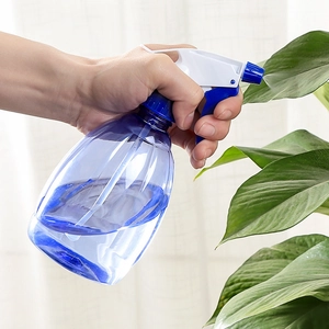 Blue transparent manual spray bottle for gardening and plant watering with mist nozzle