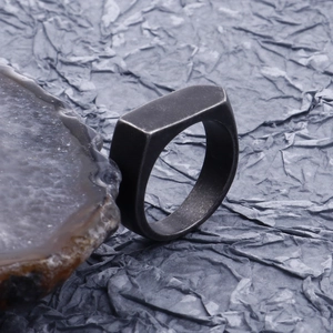 Detail view of retro geometric rectangle signet ring with vintage gunmetal finish