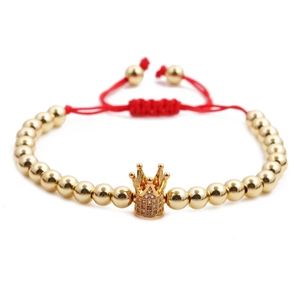 Adjustable red string bracelet with gold copper beads and a zircon crown charm