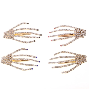 Sparkling skeleton hand hair clips with gold base and colorful rhinestones in 4-piece set