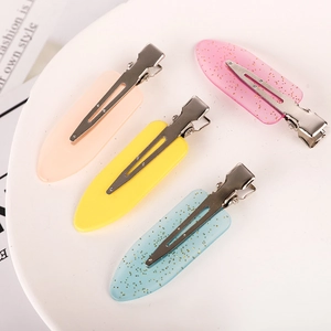 Set mit 4 bonbonfarbenen Haarspangen in Rosa, Gelb und Blau mit Glitzer-Finish