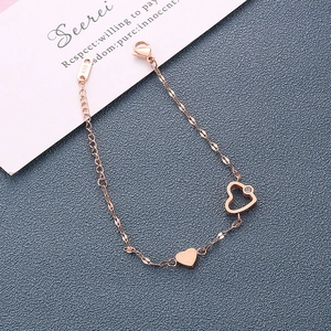 Detail of rose gold heart bracelet with sparkling zircon and K18 hallmark tag