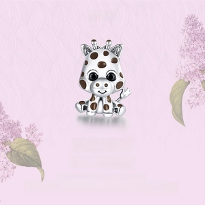 Detail of S925 sterling silver baby giraffe charm with brown enamel spots and black eyes