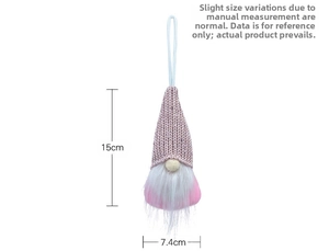 Detail of pink knitted Christmas gnome hanging ornament with dimensions 15cm x 7.4cm
