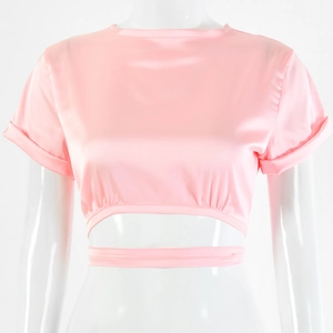 Detailed view of pink short sleeve crop top with waist hollow out and silk texture