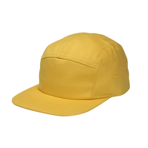 Macro detail of bright yellow cotton 5-panel camper hat with flat brim and twill texture