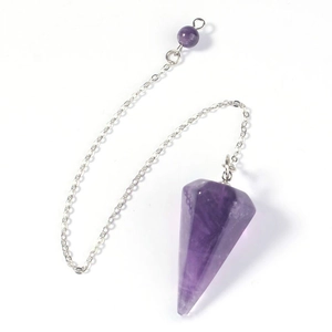 Macro shot of natural amethyst hexagonal prism crystal pendant with silver chain link
