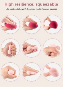 Detail showing the high elasticity and soft texture of pink beauty sponges being squeezed