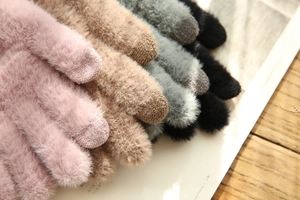 Close-up of multi-color plush faux fur gloves with conductive knit touchscreen fingertips