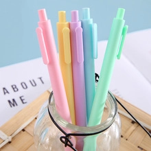 Set of 5 macaron-colored retractable gel pens in a glass jar for school stationery