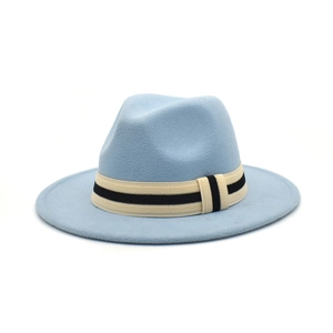 Detail of light blue wool fedora with a black and white textured decorative ribbon band