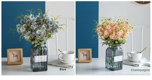Blue and champagne artificial daisy bouquets in a textured grey glass vase for home decor