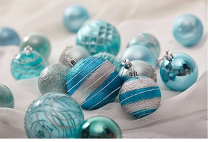 Detailed view of blue and silver Christmas ornaments with glitter and matte textures