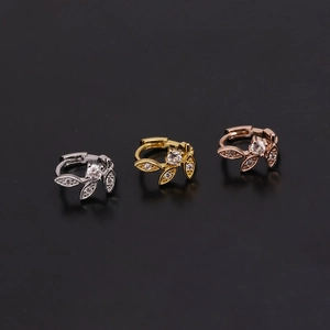 Detailed trio of leaf cartilage earrings in silver, gold, and rose gold with zircon